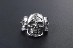 Detail shot of vintage punk skull ring for men with lightning crack design in steel