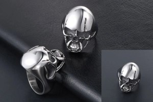 Macro shot of skull ring showing detailed stainless steel texture and gothic carving