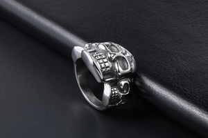 Close-up of vintage punk skull ring in silver stainless steel with detailed carvings