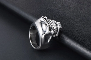 Macro detail of silver bearded skull ring in vintage stainless steel with antique finish
