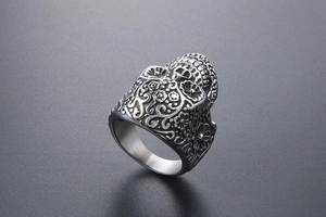 Detailed relief of punk vampire skull ring with intricate floral gothic carvings