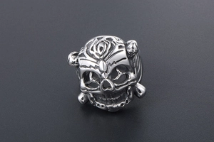 Detailed view of silver stainless steel lion ring with intricate gothic skull patterns