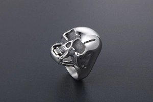 Macro detail of gothic skull ring in titanium steel with realistic bone texture and finish
