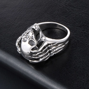 Gothic punk skull ring in silver stainless steel with skeletal hand details for men