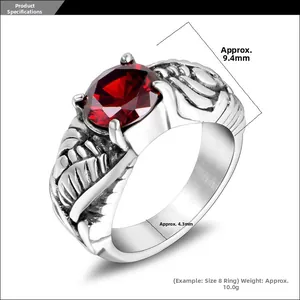 Detailed view of vintage wing ring showing 9.4mm red gemstone and 4.3mm metal band