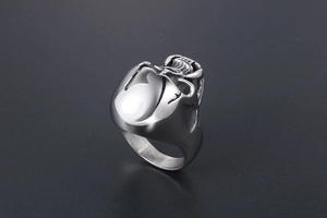 Macro detail of gothic skull ring with zombie teeth in vintage stainless steel finish