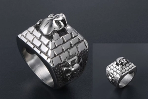 Macro view of vintage skull pyramid ring in punk style with detailed steel textures