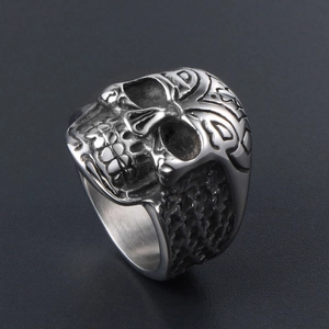 Vintage stainless steel skull ring for men with intricate carvings and aged silver finish