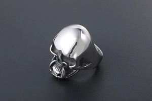 Detailed close-up of gothic skull ring showing realistic teeth and eye sockets in titanium steel
