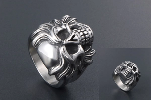 Macro detail of gothic skull ring in polished titanium steel with intricate relief texture