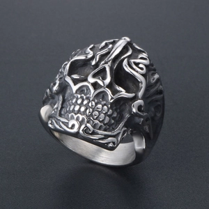 Vintage stainless steel skull ring with intricate cloud patterns and matte silver finish