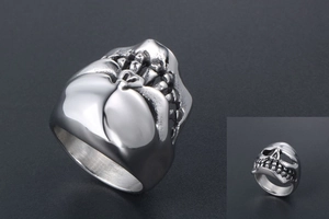 Detail view of punk skull ring in titanium steel featuring heavy metal texture and polished finish