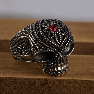 Gothic skull ring for men in retro steel finish featuring a red round stone inlay
