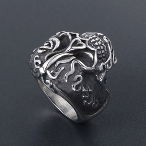 Vintage steel skull ring with embossed clouds pattern and gothic oxidized finish