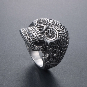 Vintage punk vampire skull ring in stainless steel with intricate floral carvings