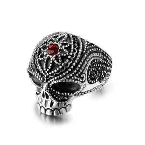 Gothic skull ring in vintage steel with detailed bead texture and a red center stone