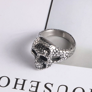 Detailed view of the silver skull ring with gothic cracked texture and punk style