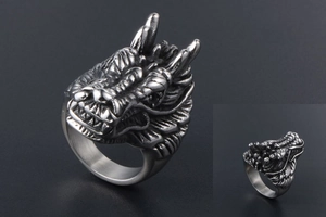 Detailed close-up of retro dragon head ring showing realistic scales and horn engraving