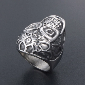 Punk vintage titanium steel skull ring with intricate tribal relief and oxidized finish