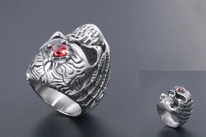 Detailed view of Gothic titanium steel skull ring featuring a vibrant red gemstone centerpiece