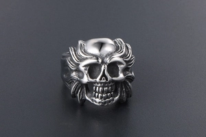Detailed view of silver skull ring with vintage black oxidation for punk style aesthetics