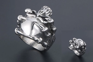 Detailed macro view of silver punk skull ring with gothic skeletal 3D relief structure