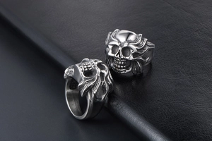 Detailed macro view of Gothic skull ring featuring intricate flame-shaped engravings