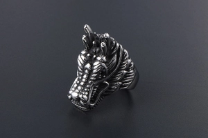 Detailed view of vintage punk dragon head ring made of distressed titanium steel