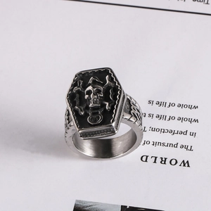 Detailed view of Gothic coffin-shaped skull ring with brushed vintage stainless steel finish