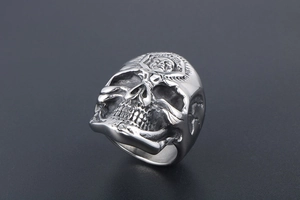 Macro detail of gothic skull ring with buddha forehead engraving and blackened silver finish