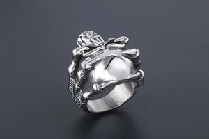 Macro detail of gothic skull claw ring crafted from polished stainless steel punk band