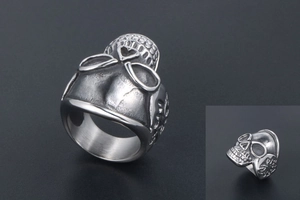 Close-up of vintage titanium steel skull ring with intricate gothic punk embossed details
