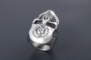 Macro detail of punk skull ring featuring vintage star emblem and relief engraving