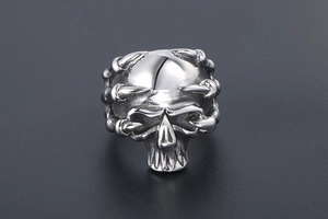 Detailed view of punk style silver skull ring wrapped in intricate eagle claws