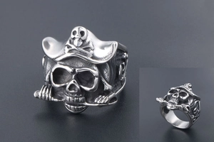Macro detail of vintage pirate skull ring in stainless steel with antique silver finish