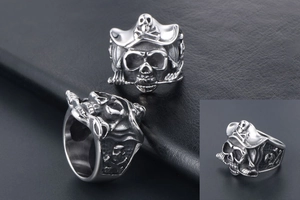 Macro detail of retro stainless steel pirate skull ring with vintage silver finish