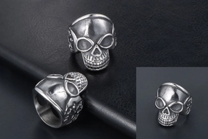 Detailed macro view of retro skull ring in titanium steel with punk texture and dark finish