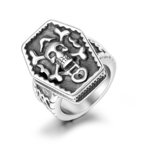 Gothic pirate skull coffin ring in vintage oxidized steel shown at a 45-degree angle