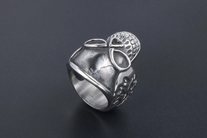 Detailed macro view of vintage skull ring with heart eye sockets and grid patterns