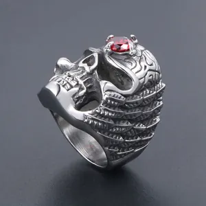 Gothic titanium steel skull ring with red gemstone inlay and wing details in silver finish