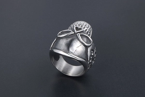 Close-up of vintage titanium steel skull ring with heart-shaped hollow butterfly design