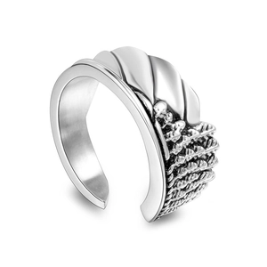 Close-up of angel wing ring featuring vintage textured details and polished silver steel