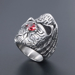 Gothic titanium steel men's ring with skull relief and a vibrant red gemstone centerpiece