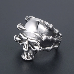 Punk style stainless steel skull ring with 3D dragon claw details in silver finish