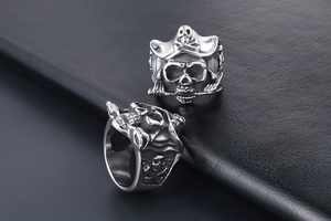 Detail of vintage skull pirate ring in stainless steel with carved crossbones