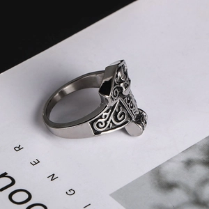 Detail of vintage Mjölnir ring featuring intricate Celtic spiral knotwork patterns