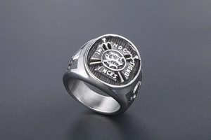 Detailed relief of punk anchor skull signet ring with vintage cross and Latin engraving