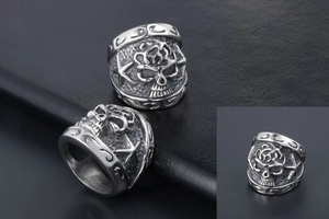 Macro detail of gothic skull ring with relief starfish patterns in vintage titanium steel