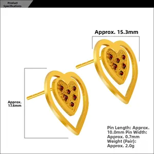 Detail showing 18K gold heart stud earrings with nested design and red gems inlay
