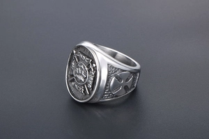 Detail view of vintage crusader shield crest on polished stainless steel punk ring